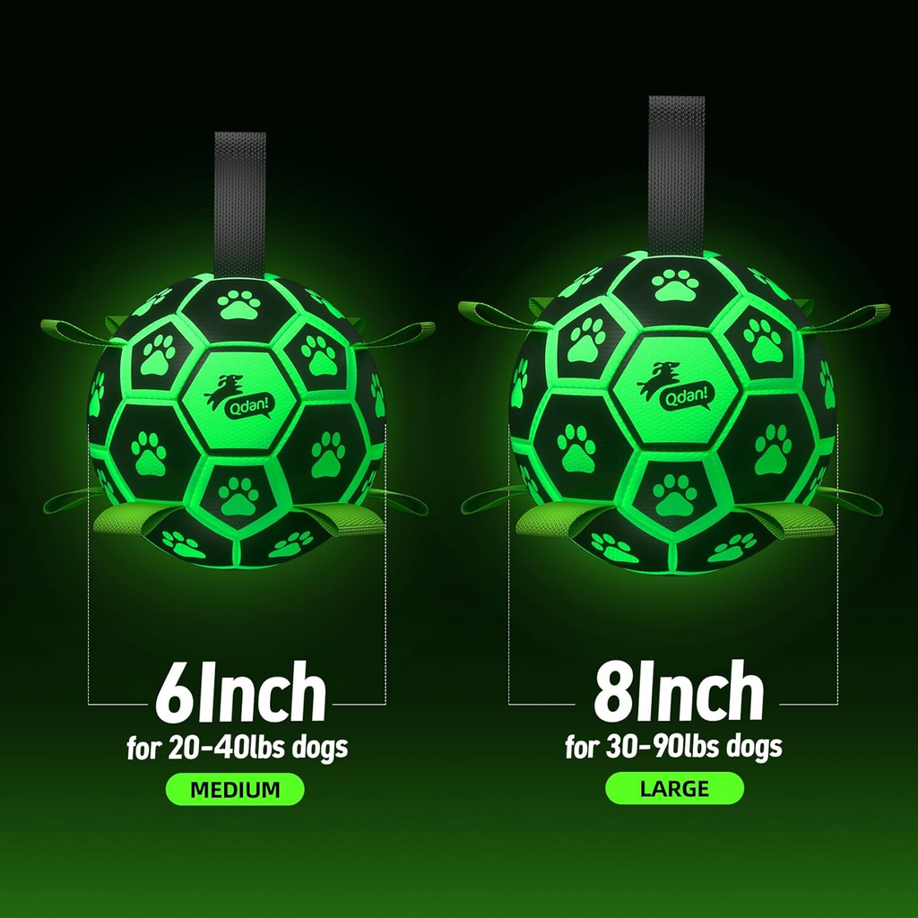 Two green dog toys with paw patterns on a black background, labeled for different sizes.