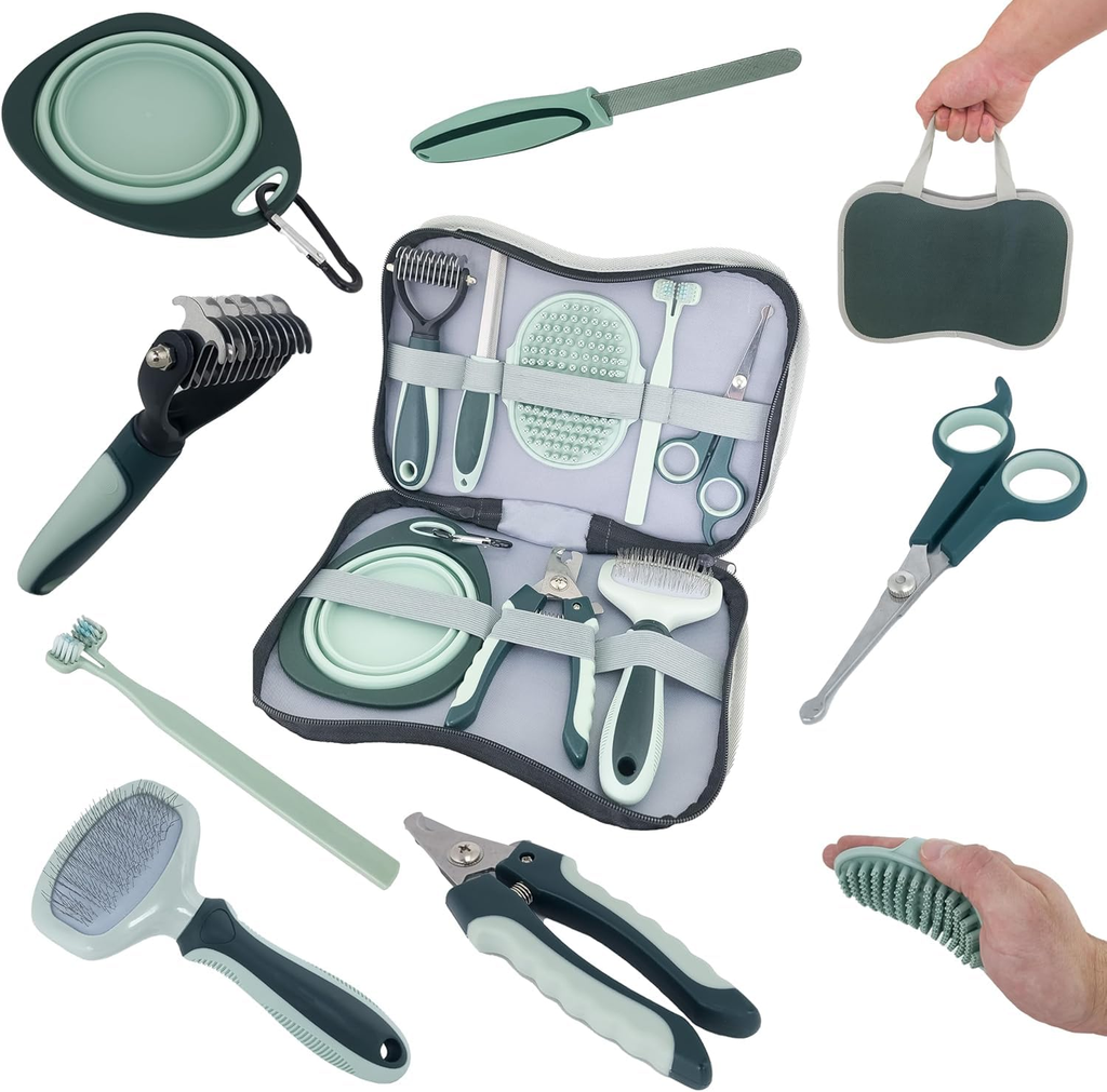 Pet grooming tools set with open case, tools, and accessories on a white background